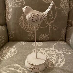 Cute white bird on a pedestal